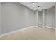 Neutral, empty room with neutral carpet and track lighting creates a versatile space for various uses at 2548 Faiss Dr, Las Vegas, NV 89134