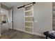Hallway featuring a frosted glass sliding door and modern interior design at 2548 Faiss Dr, Las Vegas, NV 89134