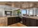 Bright, open kitchen with a large center island, modern appliances, and wood-look flooring at 2548 Faiss Dr, Las Vegas, NV 89134