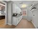 Bright laundry room with white cabinets, light countertops, and tile flooring at 2548 Faiss Dr, Las Vegas, NV 89134