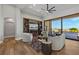 Elegant living room with ceiling fan, built-in media center, and large windows showcasing the landscape at 2548 Faiss Dr, Las Vegas, NV 89134