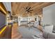 Open-concept living area with modern decor, flowing into a kitchen with a large island at 2548 Faiss Dr, Las Vegas, NV 89134