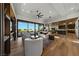 Bright living room featuring modern furnishings, a ceiling fan, and beautiful outdoor views at 2548 Faiss Dr, Las Vegas, NV 89134
