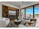 Cozy living room with built-in shelving, a fireplace, and a sliding door leading outside at 2548 Faiss Dr, Las Vegas, NV 89134