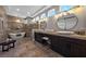 Spa-like bathroom with a soaking tub, dual vanities, and elegant lighting at 2548 Faiss Dr, Las Vegas, NV 89134