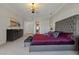 Elegantly designed main bedroom with a tufted headboard, sophisticated decor, and ample space at 2548 Faiss Dr, Las Vegas, NV 89134