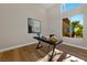 Sunlit office space with modern desk and a view of the outdoor landscape at 2548 Faiss Dr, Las Vegas, NV 89134