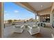 Outdoor patio seating area with mountain views at 2548 Faiss Dr, Las Vegas, NV 89134