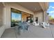 Outdoor patio with modern seating and a dining area at 2548 Faiss Dr, Las Vegas, NV 89134