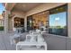 Outdoor patio with modern seating and views into the house at 2548 Faiss Dr, Las Vegas, NV 89134