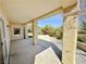 Back patio with stucco columns looking out to landscaped backyard at 2558 Grandville Ave, Henderson, NV 89052
