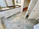 Well-lit bathroom boasting a dual sink vanity with stone countertop at 2558 Grandville Ave, Henderson, NV 89052