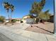 Well-maintained single-story home with desert landscaping, large driveway and a two-car garage at 2558 Grandville Ave, Henderson, NV 89052