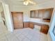 This office features built-in wooden cabinets, drawers, a desk, tile flooring, and natural light from the window at 2558 Grandville Ave, Henderson, NV 89052