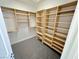 Organized walk-in closet with custom shelving and ample storage space at 2558 Grandville Ave, Henderson, NV 89052