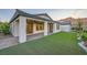 Home exterior showing patio, artificial turf, and tasteful landscaping at 26 Sun Mirage Ave, Henderson, NV 89011