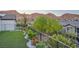 Well-maintained backyard with artificial turf, garden beds, and mountain views at 26 Sun Mirage Ave, Henderson, NV 89011