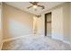 Bedroom with neutral walls, carpet, ceiling fan, and closet at 26 Sun Mirage Ave, Henderson, NV 89011