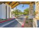 An ornate community entrance with desert landscaping and a paved entryway at 26 Sun Mirage Ave, Henderson, NV 89011