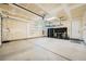 Spacious garage with storage shelves, workbench, and door to the house at 26 Sun Mirage Ave, Henderson, NV 89011