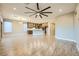 Expansive living area featuring a kitchen with an island and modern lighting at 26 Sun Mirage Ave, Henderson, NV 89011