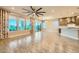 Bright, open-concept living space with modern kitchen, island, and seamless access to the outdoor patio at 26 Sun Mirage Ave, Henderson, NV 89011