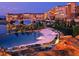 Luxury resort-style pool with lounge chairs and picturesque architecture at 26 Sun Mirage Ave, Henderson, NV 89011