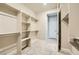Spacious walk-in closet with shelving and carpet floors at 26 Sun Mirage Ave, Henderson, NV 89011