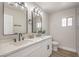 Contemporary bathroom features dual sinks, a quartz countertop, and modern fixtures at 2629 Blue Reef Dr, North Las Vegas, NV 89032
