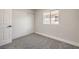 Bedroom with modern sliding door closet and a window letting in natural light at 2629 Blue Reef Dr, North Las Vegas, NV 89032