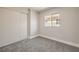 Small bedroom features neutral walls, carpet flooring, a closet, and a window at 2629 Blue Reef Dr, North Las Vegas, NV 89032