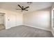 Bright bedroom features neutral walls, carpet flooring, a large closet, and a window at 2629 Blue Reef Dr, North Las Vegas, NV 89032