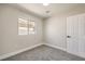Cozy bedroom features neutral walls, carpet flooring, and a window at 2629 Blue Reef Dr, North Las Vegas, NV 89032
