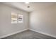Neutral bedroom features carpet flooring and a window at 2629 Blue Reef Dr, North Las Vegas, NV 89032