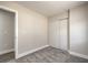 Small bedroom features neutral walls, carpet flooring, a closet, and ensuite bathroom access at 2629 Blue Reef Dr, North Las Vegas, NV 89032