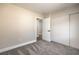 This bedroom has new gray carpet, a closet and a window to let in plenty of light at 2629 Blue Reef Dr, North Las Vegas, NV 89032
