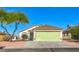 Charming single-story home featuring a well-maintained lawn and a two-car garage at 2629 Blue Reef Dr, North Las Vegas, NV 89032