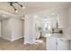 Modern kitchen featuring white cabinets, marble countertops, and stainless steel appliances at 2629 Blue Reef Dr, North Las Vegas, NV 89032