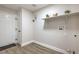 Functional laundry area with wood-look floors and ample storage space at 2629 Blue Reef Dr, North Las Vegas, NV 89032