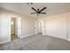 Large main bedroom offers neutral walls, carpet flooring, two closets, and ensuite bathroom access at 2629 Blue Reef Dr, North Las Vegas, NV 89032