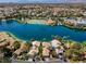 Gorgeous aerial view of a lakefront community featuring lush landscaping and beautiful homes at 2708 Port Of Call Dr, Las Vegas, NV 89128