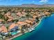 Aerial view featuring waterfront homes, swimming pools, and beautiful landscaping at 2708 Port Of Call Dr, Las Vegas, NV 89128