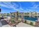 Scenic backyard patio with direct water access, a lush pergola, and ample space for entertaining at 2708 Port Of Call Dr, Las Vegas, NV 89128