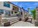 An eye-level view of the house showcasing the patio, stone design and canal view at 2708 Port Of Call Dr, Las Vegas, NV 89128