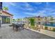 Beautiful backyard patio with water view and elegant outdoor dining set, ideal for enjoying scenic meals at 2708 Port Of Call Dr, Las Vegas, NV 89128