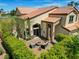 Backyard with outdoor seating area and lush landscaping at 2708 Port Of Call Dr, Las Vegas, NV 89128