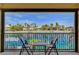 Charming balcony view of a waterfront community with lush palm trees at 2708 Port Of Call Dr, Las Vegas, NV 89128