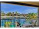 Balcony view overlooking waterfront homes and lush landscaping, perfect for entertaining at 2708 Port Of Call Dr, Las Vegas, NV 89128