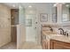 Bathroom featuring double sinks with granite countertops and a spacious glass-enclosed shower at 2708 Port Of Call Dr, Las Vegas, NV 89128