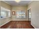 Spacious room with hardwood flooring, large mirrored closet, and beautiful water views at 2708 Port Of Call Dr, Las Vegas, NV 89128
